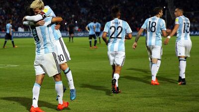 Argentina's Lionel Messi, second left, celebrates with Angel Di Maria (L) after scoring against Uruguay. Nicolas Aguilera / EPA