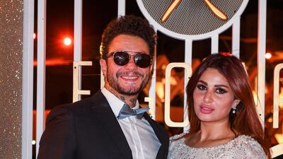 Egyptian actor Ahmad Fishawi and wife Nada Kamel pose for a photo.