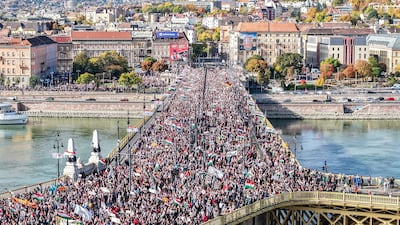 A peace march crosses the Margaret Bridge in Budapest on the 69th anniversary of the Hungarian revolution and war of independence against communist rule and the Soviet Union. AP