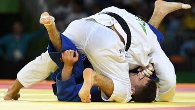 UAE’s Sergiu Toma in action against Italy’s Matteo Marconcini during their men’s 81kg judo bronze medal A match of the Rio 2016 Olympic Games in Rio de Janeiro on August 9, 2016. Tosifhumi Kitamura / AFP