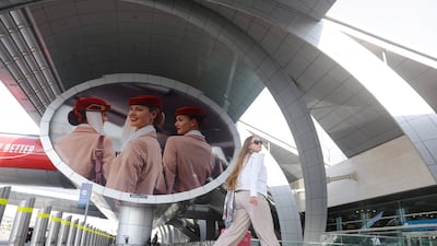 Emirates airline is advertised outside Terminal 3 at Dubai International Airport. Reuters