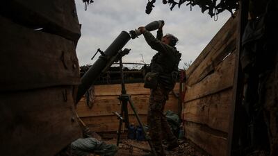 A Ukrainian serviceman loads a shell into a mortar, in Zaporizhzhia region, in September. Reuters