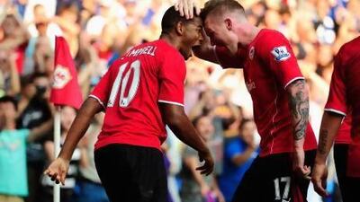 Fraizer Campbell, left, and Aron Gunnarsson celebrate after the third Cardiff goal during their win over Manchester City.