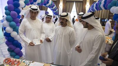 Jaber Al Suwaidi, General Director of the Crown Prince Court - Abu Dhabi (L) and Sheikh Khalifa bin Tahnoon , Director of the Martyrs' Families' Affairs Office of the Abu Dhabi Crown Prince Court (C), attend the launch of "Challenge Yourself Programme Three, Wellness Day 2017", at the Crown Prince Court. Hamad Al Kaabi / Crown Prince Court - Abu Dhabi