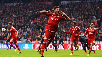 Mario Mandzukic, left, scored 33 goals during two successful seasons with Bayern Munich. Lars Baron / Getty Images
