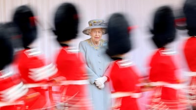 Britain's Queen Elizabeth II watches as members of the royal guard march at Windsor Castle. Reuters