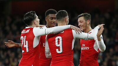 Arsenal players celebrate after a goal in their 6-0 win on Wednesday night. Andrew Couldridge / Action Images / Reuters / October 19, 2016