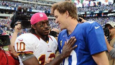 Washington's Robert Griffin III greets Eli Manning after the match with the New York Giants.