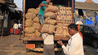 Farm produce is being unloaded at Crawford Market. Subhash Sharma for The National