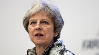 Britain's Prime Minister Theresa May walks to deliver a speech as she opens the Farnborough Airshow, south west of London, on July 16, 2018. Getty