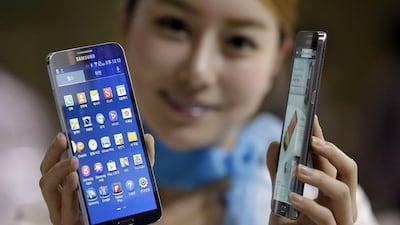A model poses with the Galaxy Round at the Korea Electronics Show in Goyang, west of Seoul. Samsung Electronics said it will release a smartphone with a curved display and a $1,000 price tag. Lee Jin-man / AP Photo