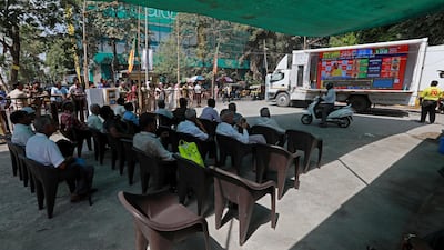 A giant screen desplays the vote counting results near the Bharatiya Janata Party office in Mumbai, India. EPA