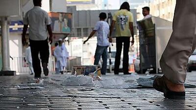The municipality has divided Sharjah into 12 waste-collection zones. Above, a littered street in Rolla.