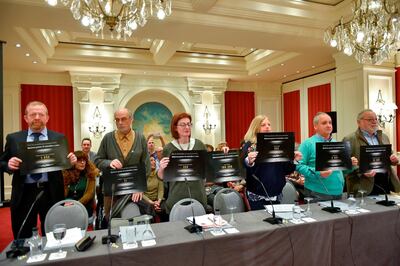 Consuelo Ordonez (3rdR), sister of Spanish Popular Party (PP) councilor Gregorio Ordonez killed by ETA, Maite Pagazaurtundua (C), sister of assassinated Joseba Pagazaurtundua, South East Fermanagh Foundation (SEFF) director Kenny Donaldson (L) hold placards during a press conference by the Association of the Victims of Terrorism of Basque Country (Covite) in the Spanish Basque city of San Sebastian. Ander Gillenea/ AFP Photo