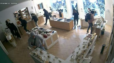CCTV footage shows a masked group breaking into a jewellery shop in Lyon, France, during the recent protests. Reuters