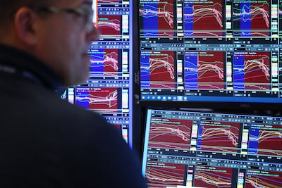A trader works on the floor of the New York Stock Exchange. AFP