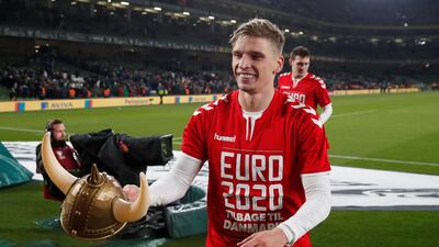 Denmark's Jens Stryger Larsen celebrates after the match. Reuters