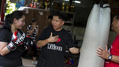 Medical sciences student Moe Pwint Oo, left, trains in Lethwei at a gym in Yangon. Ye Aung Thu / AFP