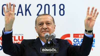 Turkish president Recep Tayyip Erdogan gestures to supporters at a rally of his Justice and Development Party in Bingol, eastern Turkey, on January 13, 2018. Pool Photo via AP