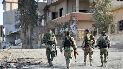 Syrian soldiers patrol the town of Al Qaryatain in central Homs province on April 3, 2016. AFP