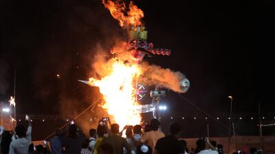 An effigy of demon king Ravana burns during the Dussehra festival celebrations in New Delhi, India. EPA