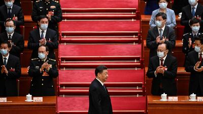 Chinese President Xi Jinping is applauded as he arrives for the fifth plenary session of the National People's Congress at the Great Hall of the People in Beijing on Sunday. AFP