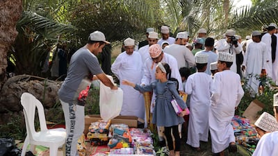 Omanis buy goods ahead of Eid Al Fitr.