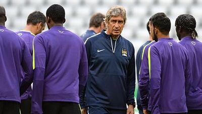 Manuel Pellegrini, centre, is eager to get Manchester City back to their winning ways. Christof Stache / AFP