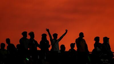 Fans cheer during the Rugby World Cup quarter-final between Wales and France at Oita Stadium, Oita, Japan Reuters