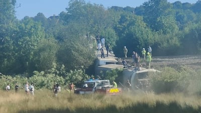 Passengers climb out of a train which derailed in Sussex, England. Photo: Laura Arnold / X