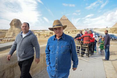 Egyptian archaeologist and former minister of antiquities Zahi Hawas in front of the Giza Pyramids, on December 6, 2017. AFP