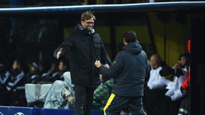 Borussia Dortmund manager Jurgen Klopp celebrates the opening goal in his side's 1-1 draw with Anderlecht on Tuesday to finish atop Group D in the Champions League. Dennis Grombkowski / Bongarts / Getty Images