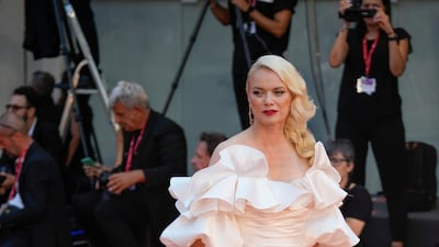German model Franziska Knuppe, in a ivory sating off-the-shoulder gown. AP