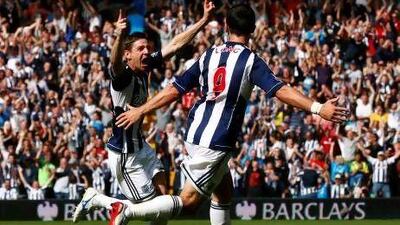 West Brom’s Zoltan Gera, left, celebrates his goal against Liverpool with Shane Long. Darren Staples / Reuters