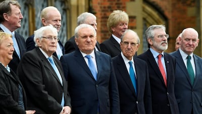 Bertie Ahern, former U.S. Senator George Mitchell, Seamus Mallon, David Trimble and Gerry Adams pose for a group photograph to celebrate the 20th anniversary of the Good Friday Agreement, in Belfast.