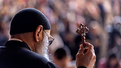 A Coptic priest leads mass as Orthodox Christians observe Good Friday prayers at the Saint Simon Monastery near Cairo. Egypt’s Grand Mufti has approved a death sentence for the murderer of a Coptic priest in April. AFP