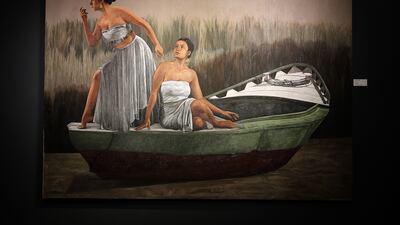 Salvation has two women posing on a boat, blades of tall grass rising in the background and water flowing underneath