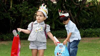 Twins Alissar and Ali Nizameddin aged 3, arrive for the Corniche Hospital Intensive Care Unit childrens party at the British Embassy in Abu Dhabi.