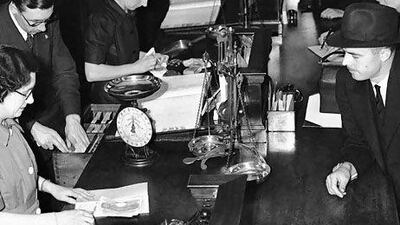 Banks are evolving with the digital age to complement the customer experience. Above, a London branch of Midland Bank in 1940. AP Photo