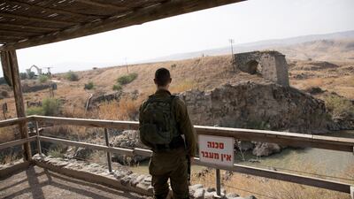 An Israeli soldier stands across the border with Jordan near Naharayim area, northern Jordan Valley, Israel in October 2018. EPA