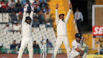 Jonny Bairstow's resistance ends as India successfully appeal for his wicket. Adnan Abidi / Reuters