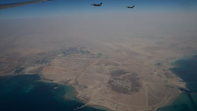 UAE Air Force fighter jets accompany Air Force One, carrying Mr Trump, as it approaches Abu Dhabi. Reuters