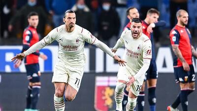 Zlatan Ibrahimovic of Milan, left, celebrates with his teammate Theo Hernandez after scoring against Genoa at Stadio Luigi Ferraris on December 1, 2021. Getty Images