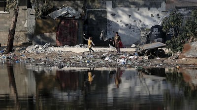 Palestinian childen play in an impoverished neighbourhood in Gaza city. AFP