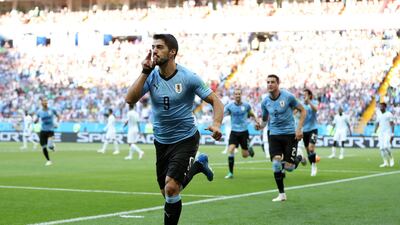 Luis Suarez celebrates after scoring the only goal of the game in Uruguay's win over Saudi Arabia. Ryan Pierse / Getty Images
