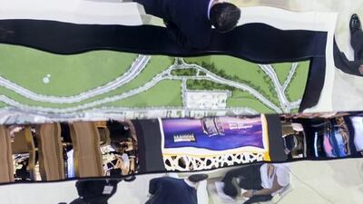 Visitors are reflected on the roof of Agaoglu’s booth at Cityscape Global 2015. Reem Mohammed / The National