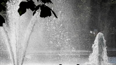 Children cool down in the fountain at Spikersuppa in Oslo. AFP