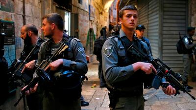 Israeli security forces stand guard at the site of a stabbing attack carried out by a Palestinian assailant in Jerusalem's Old City. The Palestinian attacker wounded a member of the Israeli security forces in the attack, before being shot dead by a policeman. Ahmad Gharabli/ AFP Photo