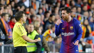 Barcelona forward Lionel Messi remonstrates with the assistant referee after his 30th-minute goal was disallowed. Heino Kalis / Reuters