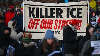 People gather for an evening vigil in Whittier Park, a few blocks from the site where Mr Pretti was fatally shot. EPA